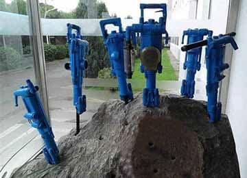 Handheld rock drilling equipment for mining